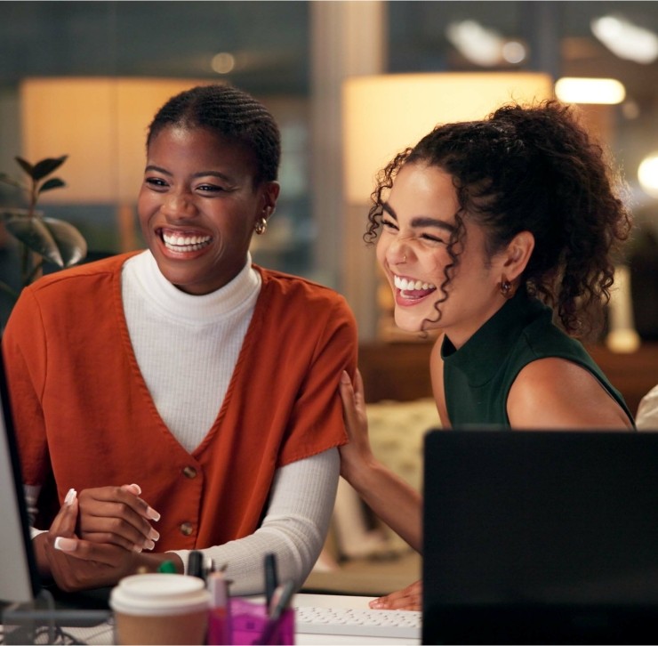 Two women in front of a laptop